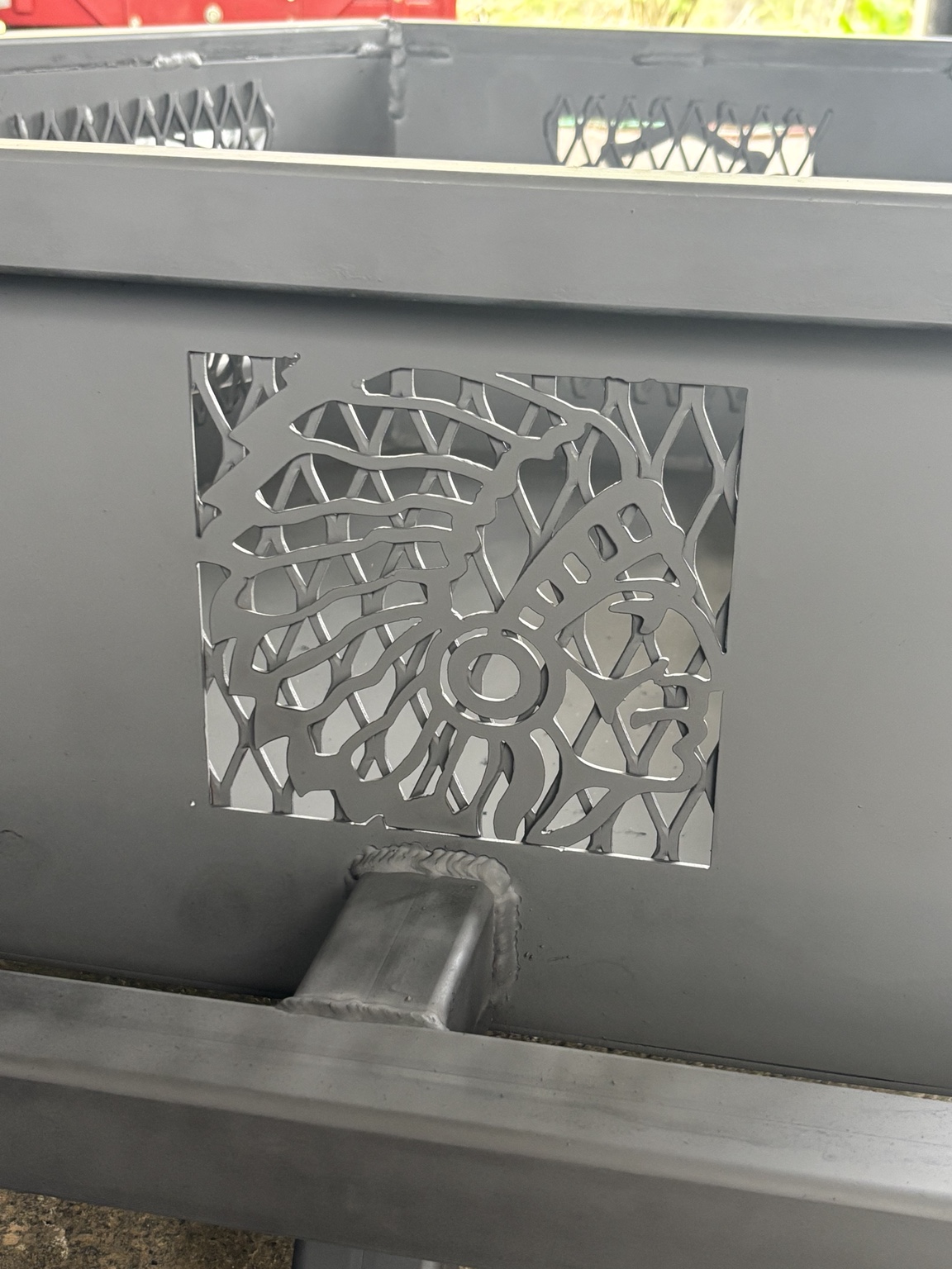 Custom fire pit with plasma-cut panels