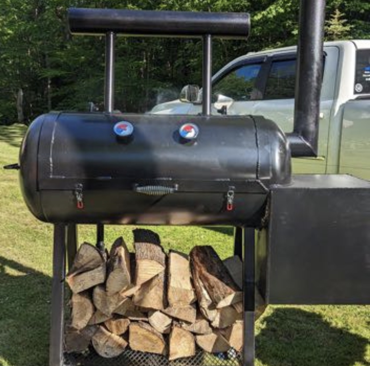 Custom offset smoker with wood storage rack